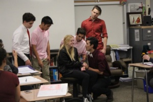 Mens choir sings to senior Jenna Billingsley during her english class on Wednesday. The mens choir sold their valgrams the week prior for three dollars.