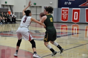 Mira Costa Senior Laura Shekter pivots around her Martin Luther King, Jr. opponent in an attempt to find an open teammate. Shekter aided the Mira Costa Girls greatly in terms of offensive plays.