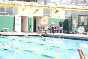 The Mira Costa Swim Team swims a short set to warm up for the Green and Gold Meet. The annual meet divided the entire team in half, and was a competition between Costa swimmers.