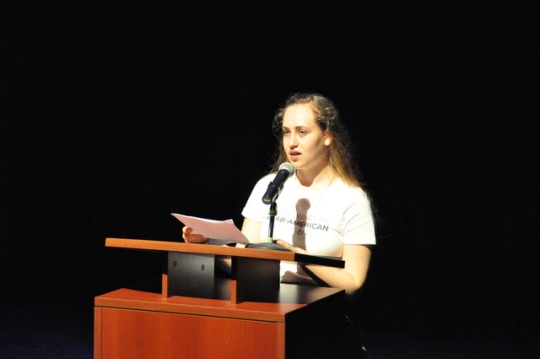 Mira Costa Junior Katherine Harfouch tells the audience the story of her extended family as well as her own heritage. Harfouch was an integral speaker at the Our Beauty Project at Mira Costa, which was held in the small theatre.