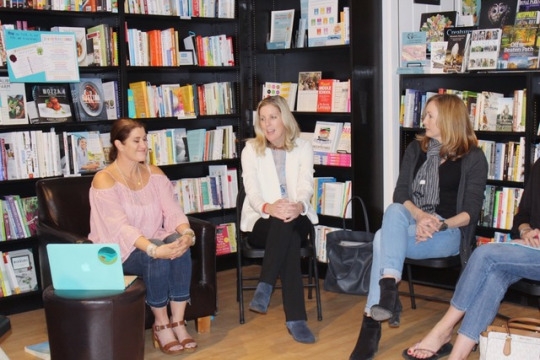 Radl (left), Steward (middle), and speaker Laura Mclntire (right) prepare to go into a mindfulness meditation. They meditated for five minutes with the audience, in order to give them a sense of the meditation practice.