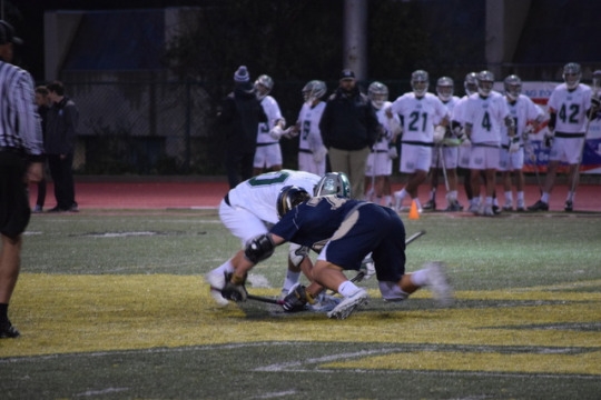 Costa player and Bosco player take the draw in the center of the field after a goal is scored. One player from each team is allowed in the circle to take the draw after a team scores.Costa player and Bosco player take the draw in the center of the field after a goal is scored. One player from each team is allowed in the circle to take the draw after a team scores.