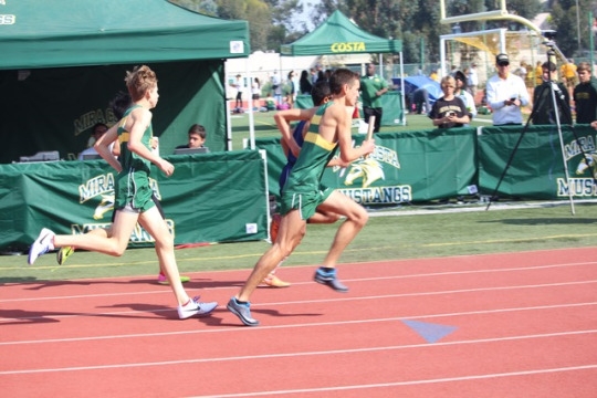 Mira Costa track athlete passes the baton to Sophomore Joseph Olivas during the Boys Medley Relay. Costa competed against teams such as Redondo Union, Culver City and Torrance High Schools.