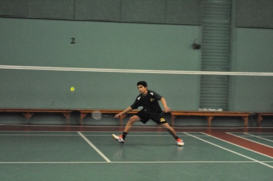 Freshman Rohil Dave moves his feet towards the birdie before returning the birdie to the other side of the court. This tournament had players from Long Beach Poly, Loara, LB Jordan, and Mira Costa High School. 