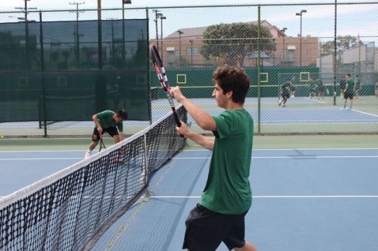 Mira Costa Junior Max Glasman rallies with one of his teammates in preparation for his game. The Mira Costa Boys played Arcadia High School at 3:00 pm on Wednesday afternoon.