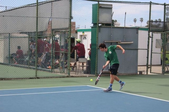 Glasman hits the ball back to his opponent in one of the first matches of the games. Glasman made many successful offensive plays that aided the Mira Costa Boys Tennis Team in their game against Arcadia.