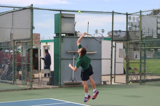 Mira Costa Junior Ben Choromanski winds up to serve a ball to his Arcadia opponent. Choromanski made many successful, swift serves during the game that resulted in many aces for the Mira Costa Boys.