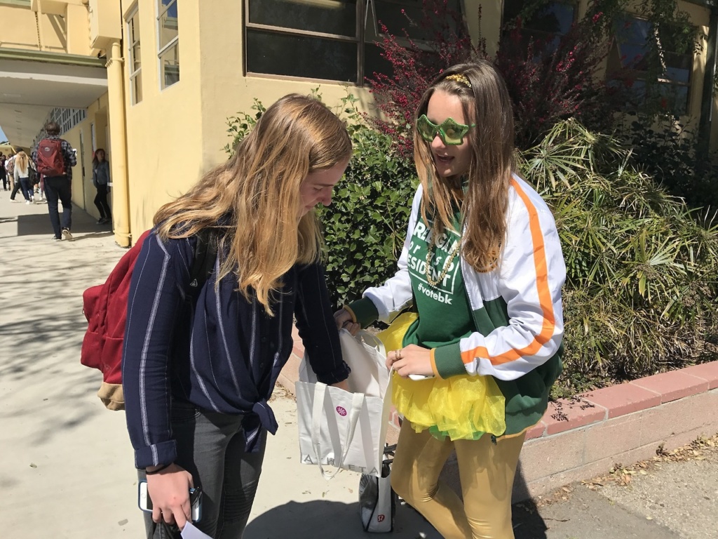  lavistamedia Junior ASB vice president Breegan Knudson(right), running for ASB president, campaigns to Camille Caflisch(left) in the Mustang Mall between passing periods. She designed t-shirts, created pins, hung up posters through out school, and handed out candy to students when she campaigned.