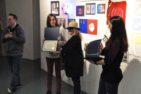 Mira Costa Junior Michelle Chambers receives an award at the Mira Costa All Media Art show for her artistic excellence. Chambers won the award for his superior skills in drawing.