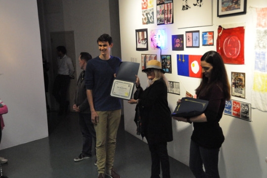 Mira Costa Senior Max Myszkowski receives an award for his artistic excellence at the showcasing of the Mira Costa All Media Art Show. Myszkowski won an award for exceeding expectations with his ceramic work.
