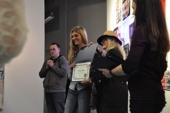 Mira Costa Junior Emma Lukin is given an award by the heads of the Mira Costa All Media Art Show. Lukin won her award for her artistic excellence in photography, and had her photos showcased at the event.