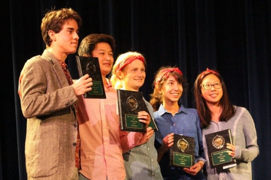  Tommy Kellher, Kevin Chen, Ella Pachler, Sophia Arnao and Jasmine Wu hold up their plaques after the match for a picture. Both teams received plaques and shook hands with the mayor after the match. 