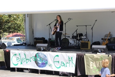 Many local singers perform at the Earth Day celebration so everyone could enjoy looking at all of the booths with music. Many of the musicians had songs about recycling and helping our earth in celebration of Earth Day.