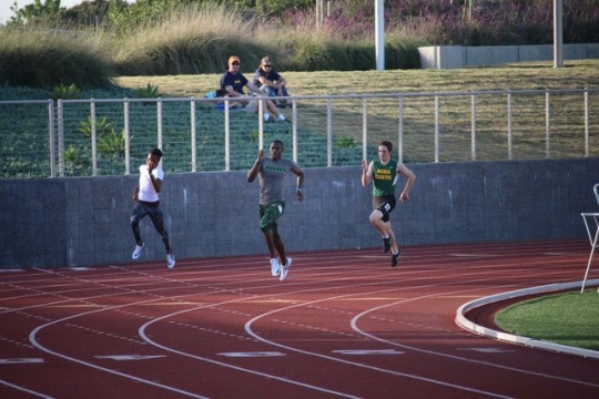  Junior, Andre Nieto (left) races hard against opponents from schools such as Dorsey and South High School. Nieto placed third in his 400 m race with a time of 51 seconds. 