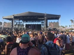 This crowd of people all listen intently to the up and coming band at Coachella this past weekend. They looked and listened as they wondered what it would be like up their performing at Coachella.