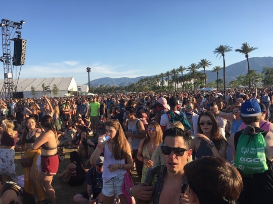 A sea of heads peer up at the band performing on a stage at Coachella this past weekend. They all crowded around each other trying to get closer look at the popular band.