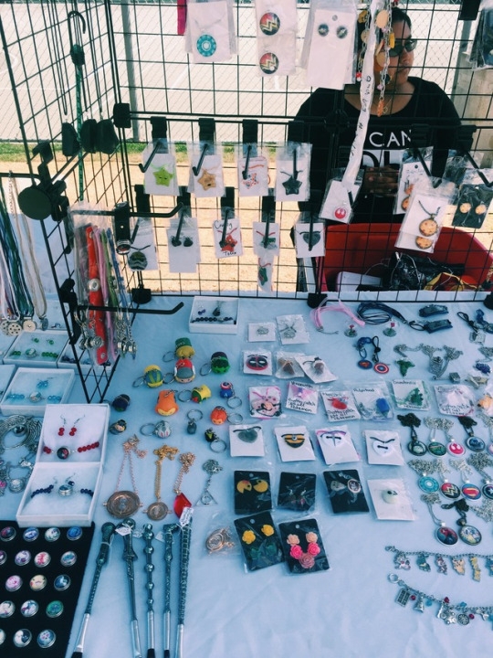 This businesswoman sells handmade pins, necklaces, bracelets, and earrings. Many booths located beside the Clark Field basketball courts sold handmade goods to the market-goers.