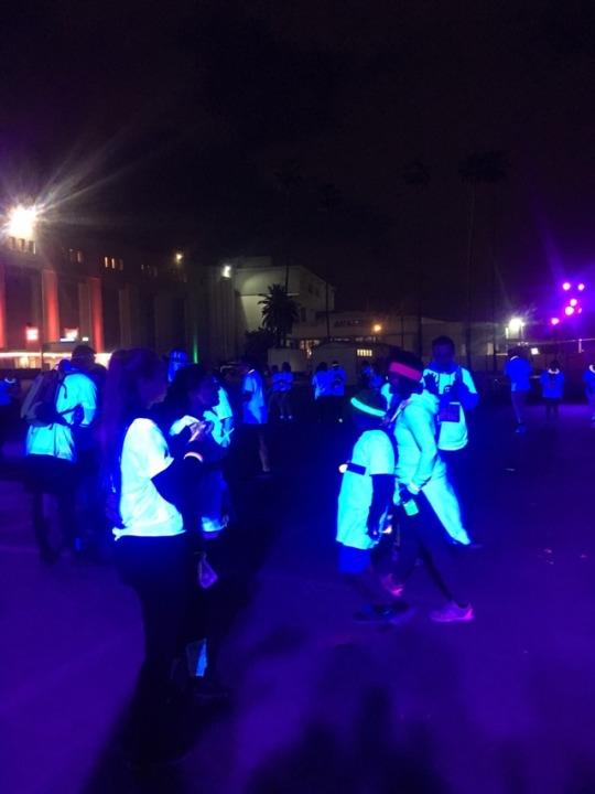 After most people finished the race it was dark outside so everyone was glowing. The black lights were turned on which made everyone that was wearing white glow.