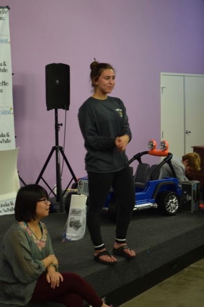 Hailey Stazkow watches over her class as they play a game to warm up for their rehearsal. Students went in a circle giving compliments to each other, then proceeded to shake out their arms and legs in preparation for their dance.