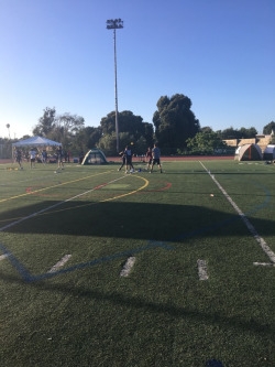 People from other teams are playing all sorts of games including spike ball and throwing a football. Many teams had different games to play to keep themselves occupied during the 24 hours.