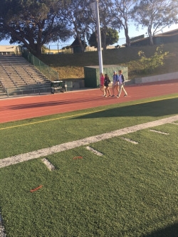  A mix of people from different teams walking the track for Relay for Life to show that cancer never sleeps. People walked all day and all night long for Relay for Life.