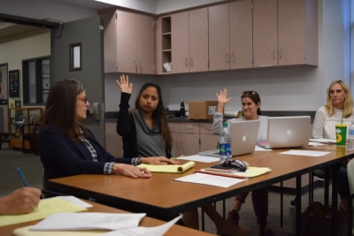 Members of the survey review team vote on which of the factors in the report have the most impact.  They decided upon lack of sleep, course load, and academic engagement.