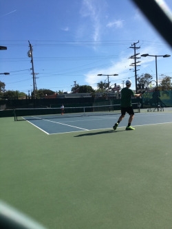 Michel Watson hitting a forehand in his singles match on May 2 2017. Michel started on the JV team as a Freshman.