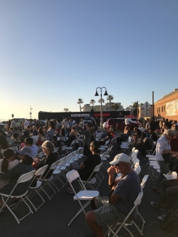  Crowds of people enjoy the award winning music of the film. The movie won many academy awards which included Best Original Music Score. 